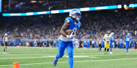 DETROIT, MICHIGAN - DECEMBER 21: Jahmyr Gibbs #0 of the Detroit Lions runs the ball for a touchdown during the second half of an NFL football game against the Pittsburgh Steelers at Ford Field on December 21, 2025 in Detroit, Michigan. Gibbs broke the NFL record for the most touchdowns scored by a player in his first three seasons previously held by Barry Sanders. (Photo by Todd Rosenberg/Getty Images)