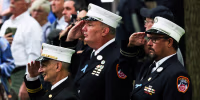 Firefighters salute during the singing of the National Anthem at the annual 9/11 Commemoration Ceremony on Sept. 11, 2022, in New York.