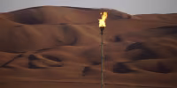 A flame burns off at an oil processing facility in Aramco's oilfield in the Rub' Al-Khali (Empty Quarter) desert in Shaybah, Saudi Arabia.