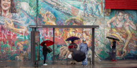 Angelenos in the Latino neighborhood of Boyle Heights wait for a bus in 2018.