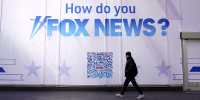 A person walks past the Fox News headquarters in New York City