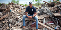 Police officer Robert Barfield Jr. at a destroyed mobile home park where he rescued tornado victims in Rolling Fork, Miss. 