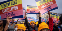 People rally to show support for the Biden administration's student debt relief plan in front of the Supreme Court on Feb. 28, 2023.