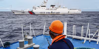 A China Coast Guard ship is seen from the Philippine Coast Guard vessel BRP Cabra in the South China Sea
