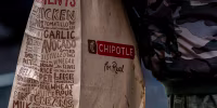 A to-go bag from Chipotle.