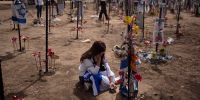 A woman grieves at a memorial for victims of the Oct. 7, 2023, Hamas attack 