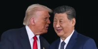 President Donald Trump talks to China's President Xi Jinping after their talks at the Gimhae Air Base in Busan, South Korea, on October 30, 2025.