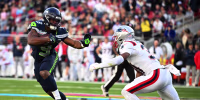 New England Patriots' safety #31 Craig Woodson rushes Seattle Seahawks' running back #09 Kenneth Walker III