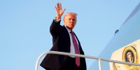 Donald Trump waves from a plane