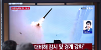 A news broadcast with file footage of a North Korean missile test, at a train station in Seoul on April 19.