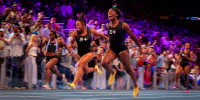 Barbados Tristan Evelyn cheers as she wins the women's 100m next to Jamaica's Denae McFarlane and US's Shania Collins.
