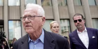 Frank stronach, outside a courthouse.