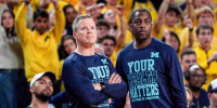 Michigan head coach Dusty May and assistance coach Mike Boynton Jr watch a free throw against Nebraska during the second half at Crisler Center in Ann Arbor on Tuesday, Jan. 27, 2026.