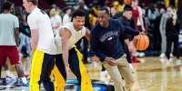 Michigan forward Yaxel Lendeborg (23) warms up with assistant coach Mike Boynton Jr. ahead of the NCAA Tournament Sweet 16 between Michigan and Alabama at United Center in Chicago on Friday, March 27, 2026.
