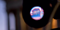 The Supreme Court is seen through the viewfinder of a television camera.