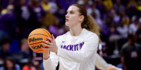 Kate Koval #13 of the LSU Tigers warms up before a basketball game.