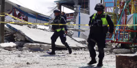 Mexican State Police officers inspect the site of a fireworks blast in Santa Maria Canchesda, Mexico state, Mexico on September 6, 2026. A fireworks explosion at a church while hundreds of people were celebrating a patron saint's festival in Mexico killed at least 10 people and left more than 60 injured, authorities reported September 6, 2026.