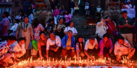 People light candles at Basantapur Durbar Square in Kathmandu, Nepal, on September 7, 2026, to honor those who lost their lives in the Bhote Koshi River floods and landslides in Rasuwa and other affected areas, as Nepal observes a national day of mourning declared by the government of Nepal. 