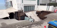 A driveway in front of a vacant seaside Malibu home collapsed early this morning after steady rainfall and high surf pounded the Los Angeles County coast.