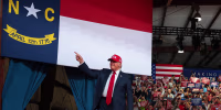 U.S. President Donald Trump greets supporters.