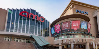 The exterior of a modern AMC IMAX movie theater.