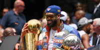 New York Knicks Karl-Anthony Towns celebrates with the trophy during the championship celebration and Key to the City ceremony at City Hall Plaza after a ticker-tape parade honoring the Knicks' NBA Finals victory in New York City on June 18, 2026. (Photo by ANGELA WEISS / AFP via Getty Images)