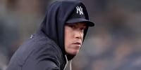Sep 23, 2026; Bronx, New York, USA; New York Yankees injured right fielder Aaron Judge (99) watches from the dugout during the fifth inning against the Tampa Bay Rays at Yankee Stadium. Mandatory Credit: Brad Penner-Imagn Images