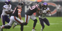 Sep 20, 2026; Chicago, Illinois, USA; Minnesota Vikings running back Aaron Jones Sr. (33) runs the ball against Chicago Bears cornerback Tyrique Stevenson (29) during the first half at Soldier Field. Mandatory Credit: Patrick Gorski-Imagn Images