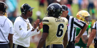 WACO, TX - SEPTEMBER 26: Head coach Deion Sanders of the Colorado Buffaloes talks with Quentin Gibson #6 of the Colorado Buffaloes after Gibson throws a punch at a Baylor player during the second half of the game on September 26, 2026, at McLane Stadium in Waco, TX. (Photo by Adam Davis/Icon Sportswire via Getty Images)