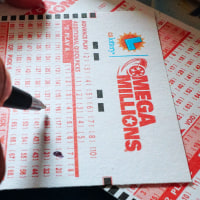 Numbers are selected on a Mega Millions lottery ticket in Los Angeles, California on October 23, 2018. - The Mega Millions jackpot, now reaching 1.6 billion USD, will be drawn on tonight. (Photo by Frederic J. BROWN / AFP)        (Photo credit should read FREDERIC J. BROWN/AFP via Getty Images)