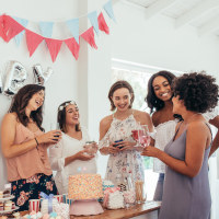 Pregnant woman celebrating baby shower with friends