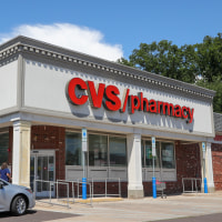 A CVS logo is displayed at one of their stores