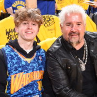 Guy Fieri and his son attend Game 1 of the 2022 NBA Playoffs Western Conference Finals.