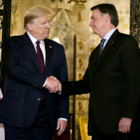 President Donald Trump shakes hands with Brazil's President Jair Bolsonaro at Trump's Mar-a-Lago resort on March 7, 2020.