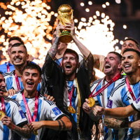 Argentina's Lionel Messi holds up the trophy after winning the World Cup in Lusail, Qatar, on Dec.18, 2022.