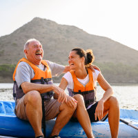 Spanish male and female enjoying early morning kayaking