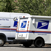 USPS vehicles parked