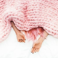 Woman Under Blanket
