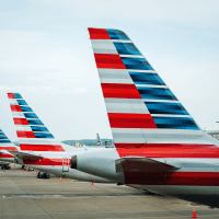 Tails of American Airline planes are seen as the planes sit parked at gates at Reagan National Airport on Thursday, April 27, 2023 in Arlington, Va.