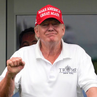 Tucker Carlson, left, and Donald Trump at the Bedminster Invitational LIV Golf tournament in Bedminster, N.J.,