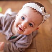 Cute Baby Girl Crawling In Living Room