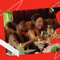 Image of group of four friends clinking wine glasses with one woman cut out