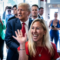 Former President Donald Trump arrives a Waffle House with Rep. Marjorie Taylor Greene