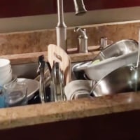 A dad is being applauded for leaving pile of dirty dishes in the sink.