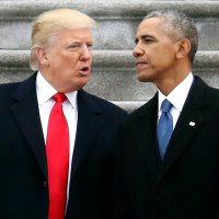 Donald Trump talks with Barack Obama.