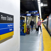 A sign directs commuters at Penn Station
