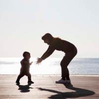 mother and baby relaxed at seaside terrace