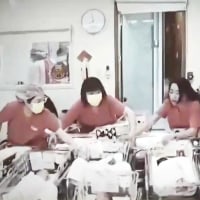 Nurses rush to protect baby during Taiwan earthquake.