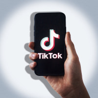 collage of hand holding a phone with tiktok on it