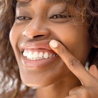 Woman showing healthy gums